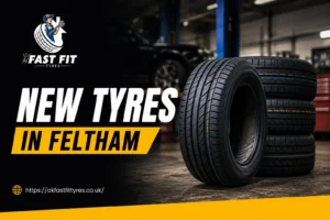 Mechanic fitting new tyres on a car at AK Fast Fit Tyres garage in Feltham