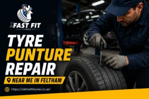 Mechanic repairing a punctured tyre at AK Fast Fit Tyres garage in Feltham
