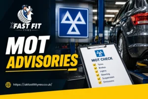 Mechanic reviewing an MOT advisory list with a customer at AK Fast Fit Tyres in Feltham